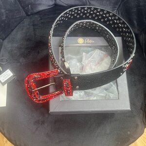 Black belt with red diamonds around